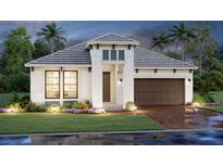 Beautiful one-story home featuring a brick-paved driveway, two car garage, and well-manicured landscaping at 17126 Savory Mist Cir, Bradenton, FL 34211