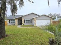 Charming single-story home with stone accents and well-maintained lawn at 23607 Forest View Dr, Land O Lakes, FL 34639