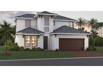 Charming two-story home with a dark roof, light stucco exterior, and a convenient two-car garage at 17232 Savory Mist Cir, Bradenton, FL 34211