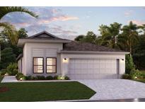 Charming single-story home featuring a two-car garage, well-manicured lawn, and welcoming curb appeal at 16848 Fiesta Dr, Port Charlotte, FL 33953