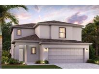 Charming two-story home with a two-car garage and well-manicured lawn in a residential neighborhood at 16854 Fiesta Dr, Port Charlotte, FL 33953