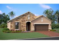 Charming one-story home featuring a stone facade, arched entryway, and well-manicured lawn at 17208 Savory Mist Cir, Bradenton, FL 34211