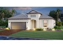 Beautifully landscaped single-story home featuring a two-car garage and neutral color palette at 17216 Savory Mist Cir, Bradenton, FL 34211