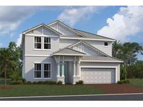 Charming two-story home with a two-car garage, manicured lawn, and well-maintained landscaping at 7544 Nighthawk Dr, Sarasota, FL 34241