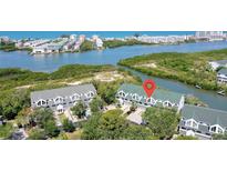 Waterfront condos offer scenic views and tranquil living near lush mangroves and sparkling waters at 9874 Indian Key Trl # 62, Seminole, FL 33776