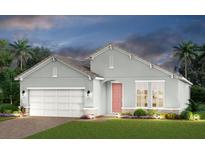 Charming single-story home featuring a two-car garage, well-manicured lawn, and inviting front entrance at 236 Vistera Blvd, Nokomis, FL 34275