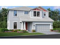Charming two-story home with a two-car garage, manicured lawn, and tropical landscaping at 7571 Hawkstone Dr, Sarasota, FL 34241