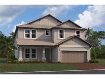 Charming two-story home with a two-car garage and beautifully manicured lawn at 17106 Savory Mist Cir, Lakewood Ranch, FL 34211