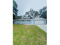 Charming single-story home with a well-maintained lawn and inviting curb appeal at 4934 Avery Rd, New Port Richey, FL 34652