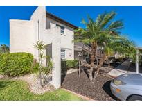 Exterior view of building with landscaping at 4555 Marine Pkwy # 202, New Port Richey, FL 34652