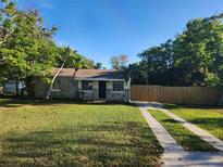 Charming stone house with a well-maintained lawn at 2309 22Nd W Ave, Bradenton, FL 34205