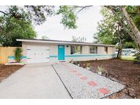 Charming ranch house with a newly paved driveway and landscaping at 4615 Lords Ave, Sarasota, FL 34231