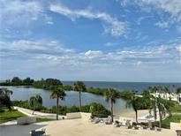 Stunning water view from condo balcony, featuring a tranquil lagoon and ocean at 6009 Sea Ranch Dr # 301, Hudson, FL 34667