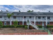 Two story building exterior with stairs and landscaping at 4744 Azalea Dr # 203B, New Port Richey, FL 34652