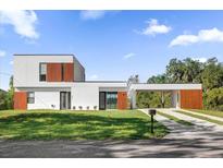 Modern two-story home with a carport and landscaped yard at 501 Chastain Rd, Seffner, FL 33584