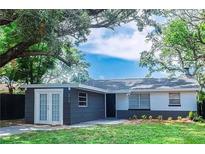 Updated home exterior with fresh landscaping and gray accents at 1274 Bertland Way, Clearwater, FL 33755