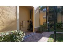 Condo building exterior showcasing a walkway and landscaping at 4333 Bayside Village Dr # 314, Tampa, FL 33615