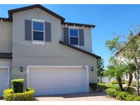 Charming two-story home featuring a two-car garage and well-maintained landscaping in a desirable neighborhood at 10096 Corso Milano Dr, Tampa, FL 33625