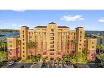 Beautiful condo building with manicured landscaping and convenient parking at 606 Riviera Dunes Way # 207, Palmetto, FL 34221