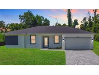 Charming single-story home with a well-manicured lawn and a freshly paved driveway under a beautiful sunset at 17041 Malta Ave, Port Charlotte, FL 33954