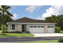 Charming single-story home with a two-car garage and beautifully manicured lawn at 9143 Players Dr, Weeki Wachee, FL 34613