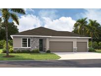 Charming single-story home boasts a stone facade, three-car garage, and lush landscaping at 9156 Players Dr, Weeki Wachee, FL 34613