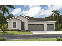 Charming single-story home featuring a three-car garage and well-maintained front lawn at 9210 Players Dr, Weeki Wachee, FL 34613