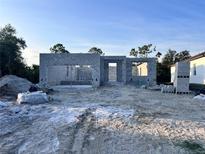New construction featuring concrete walls and rough grading, ready for customization in a promising neighborhood at 122 Naomi Pl, Rotonda West, FL 33947