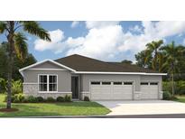 Charming one-story home featuring a three-car garage, gray stucco, and stone veneer accents at 9211 Players Dr, Weeki Wachee, FL 34613