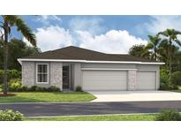 New home featuring a three-car garage and stone veneer details on the facade at 9127 Players Dr, Weeki Wachee, FL 34613