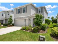 Charming two-story home with a manicured lawn and beautiful stone accents at 3255 Hilltop Cir, Bradenton, FL 34211