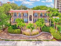 Attractive two story building with lush landscaping and palm trees at 2419 Bayshore Blvd # 2N, Tampa, FL 33629