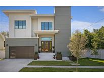Modern two-story home with gray and white exterior at 4304 W Sevilla St, Tampa, FL 33629