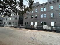 Contemporary townhouses with dark brick exterior and modern design at 1218 E Kay St # 27, Tampa, FL 33602