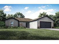 Single-story home with gray exterior, two-car garage, and attractive landscaping at 12169 Patterson Ave, Port Charlotte, FL 33981
