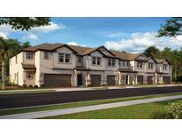 Exterior view of modern townhouses with attached garages at 8874 Gallantree Pl, Land O Lakes, FL 34637