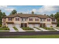 New townhome community with attached garages and landscaping at 10368 Honey Hammock Way, San Antonio, FL 33576