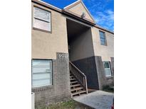 Building exterior showing stairs and address number 9027 at 9027 Westchester Cir # 118, Tampa, FL 33604