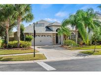 Single-Gathering home with two-car garage and landscaped yard at 3001 Silvermill Loop, Land O Lakes, FL 34638