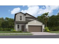 Two-story home with brown garage door and gray siding at 2530 Leonia Ln, Zephyrhills, FL 33541