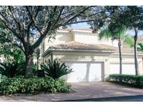 Beautiful two-story house with a lush, manicured yard at 1708 Triano Cir # 1708, Venice, FL 34292