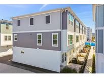 Modern building exterior with gray and white siding at 460 31St N Ln, St Petersburg, FL 33713