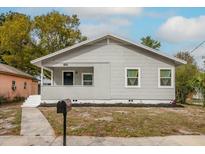 Charming bungalow style home with gray siding and a front porch at 3007 Dixie Ave, Sarasota, FL 34234