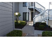 Exterior view showing walkway to condo entrance with landscaping at 2722 71St Street W Ct # 2722, Bradenton, FL 34209