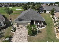 Single-Gathering home with landscaped yard, aerial view at 404 Grand Chateaux Way, Sun City Center, FL 33573