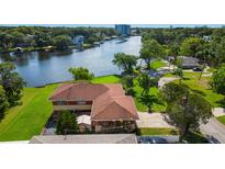 Aerial view of a single-Gathering home with a red roof near the waterfront at 2111 W Ivy St, Tampa, FL 33607