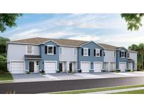 Exterior view of townhouses with garages at 2753 Banks Pointe Dr, Bradenton, FL 34208