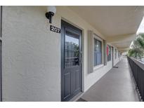 Exterior view of building showcasing unit entrance at 315 30Th W Ave # B207, Bradenton, FL 34205