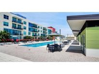 Resort-style pool with plenty of lounge chairs at 1120 E Kennedy Blvd # 827, Tampa, FL 33602