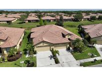 Aerial view of a house with a two-car garage at 211 Mystic Falls Dr, Apollo Beach, FL 33572